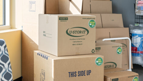 Neatly organized storage unit with boxes and household items at U-Stor-It.