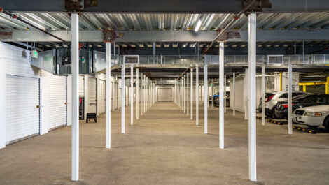 Interior of self storage facility, view of elevator and parking lot.