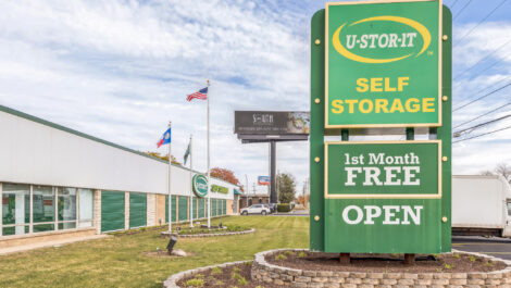 Exterior view of U-Stor-It self storage facility, view of sign.